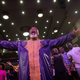 Worshippers pray during Sunday service at the House of Praise church in London.